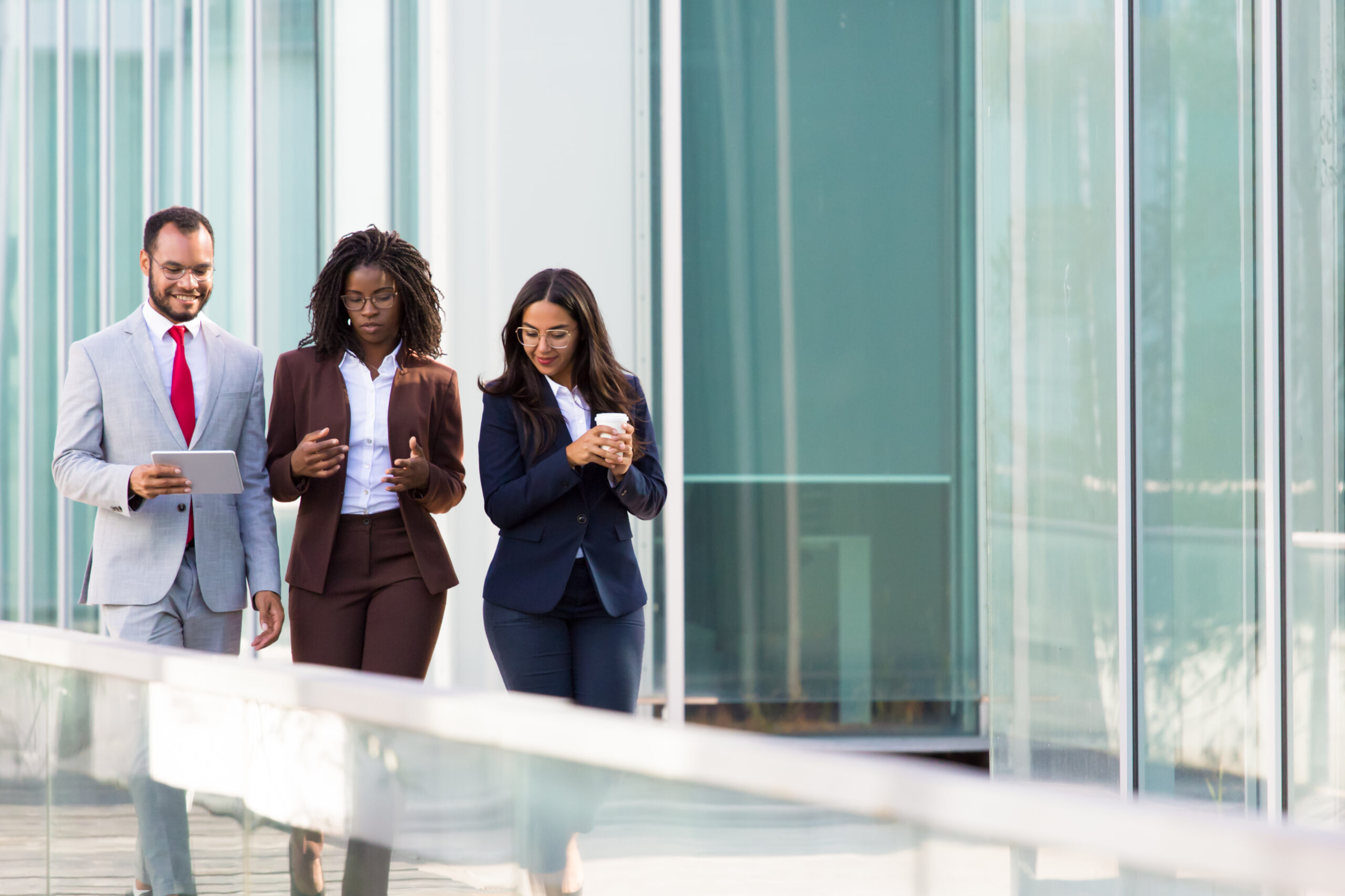 Three colleague discussing ethical implementation of AI in the workplace